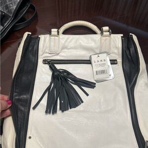 L.A.M.B. Black and White bag with Tassel